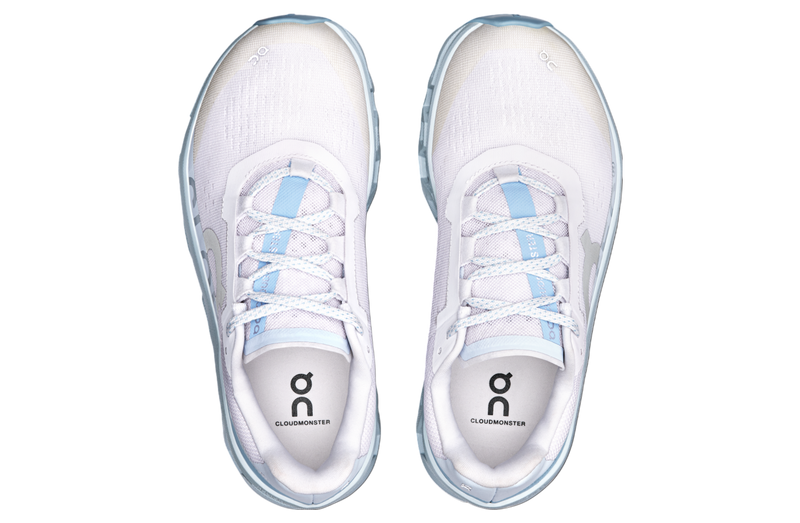 On Cloudmonster WMNS Frost / Wash running shoe with CloudTec cushioning, combining icy blue and neutral tones for a stylish, comfortable design.