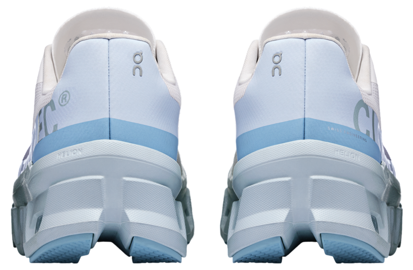 On Cloudmonster WMNS Frost / Wash running shoe with CloudTec cushioning, combining icy blue and neutral tones for a stylish, comfortable design.