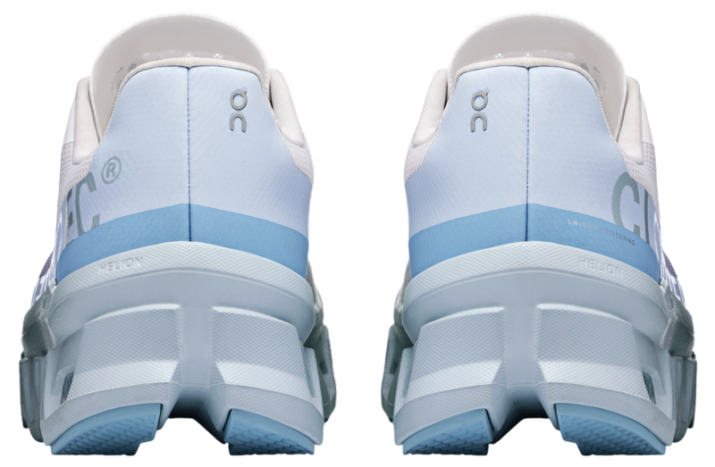 On Cloudmonster WMNS Frost / Wash running shoe with CloudTec cushioning, combining icy blue and neutral tones for a stylish, comfortable design.