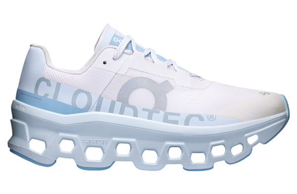 On Cloudmonster WMNS Frost / Wash running shoe with CloudTec cushioning, combining icy blue and neutral tones for a stylish, comfortable design.