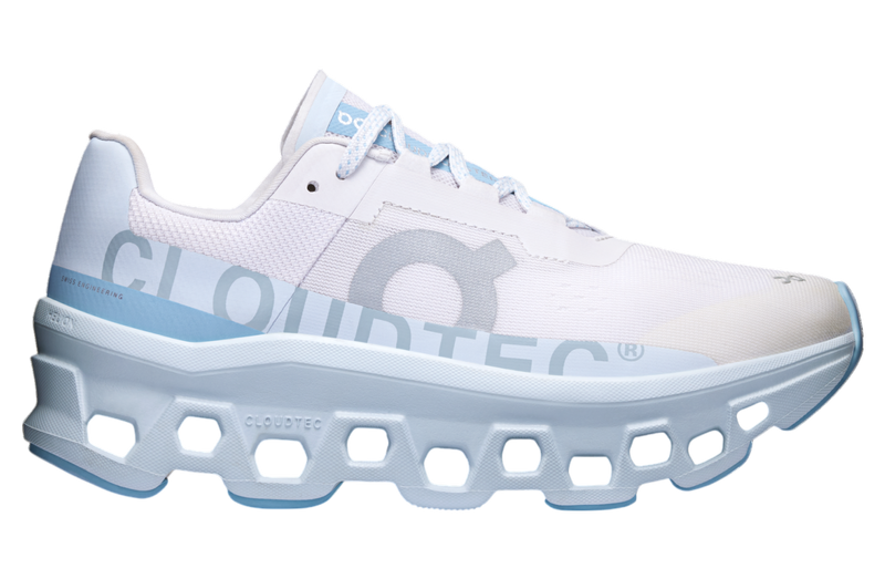 On Cloudmonster WMNS Frost / Wash running shoe with CloudTec cushioning, combining icy blue and neutral tones for a stylish, comfortable design.