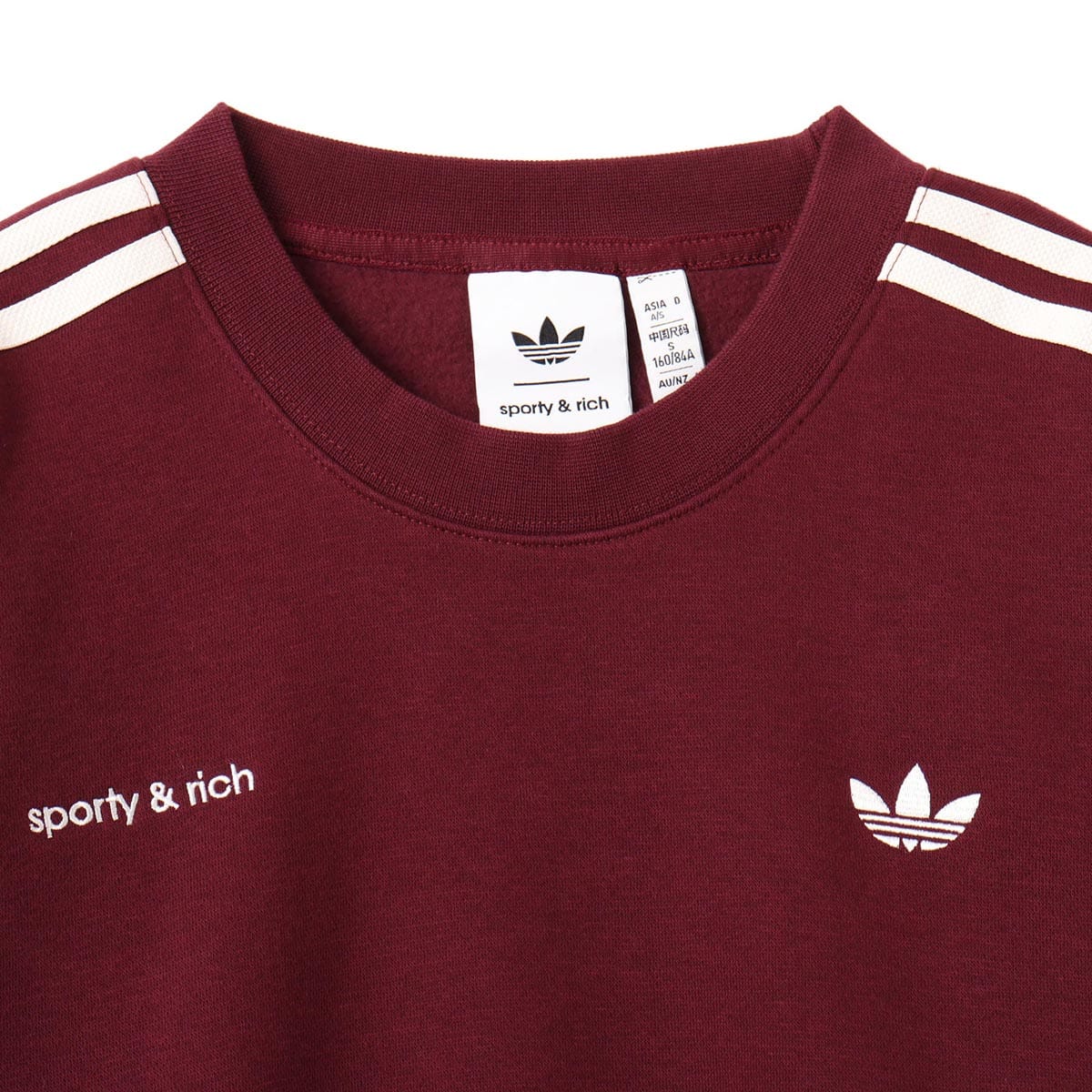 Sporty & Rich x adidas sweatshirt in soft cotton with a slim fit, ribbed cuffs, hem, and crew neck for a refined yet comfortable style.