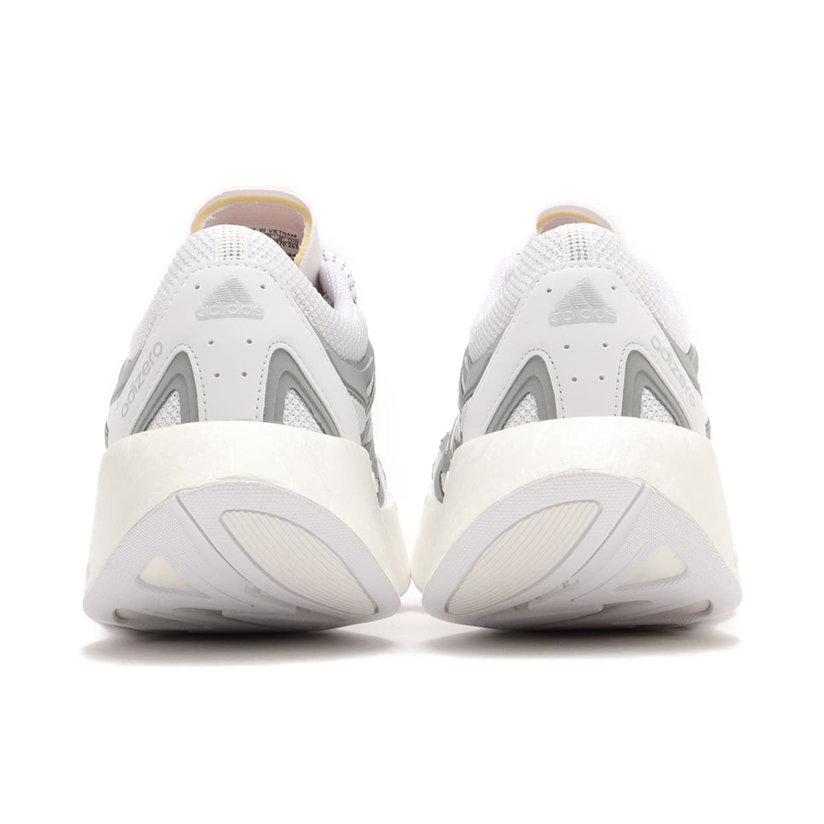 Adizero Arc shoes with Swirlfoam cushioning, a rocker-shaped sole, and a durable rubber outsole, inspired by 2000s running sneakers.