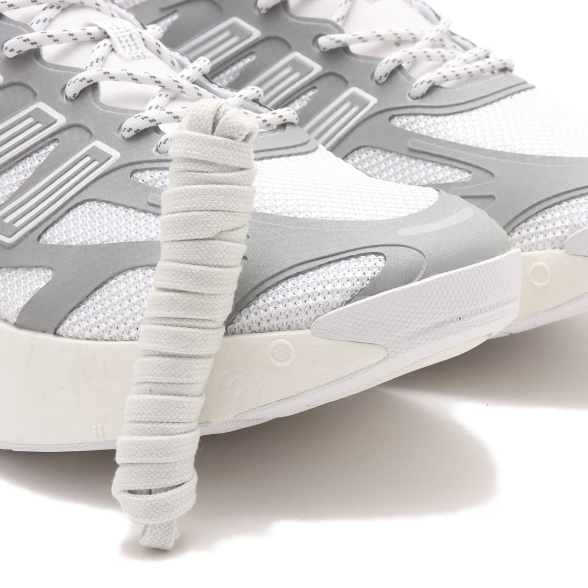 Adizero Arc shoes with Swirlfoam cushioning, a rocker-shaped sole, and a durable rubber outsole, inspired by 2000s running sneakers.