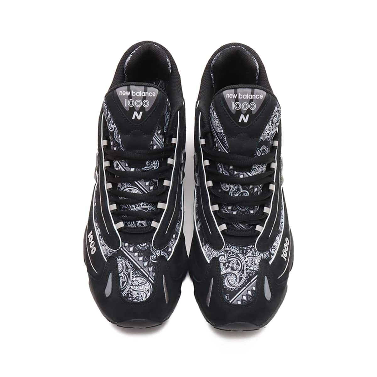 atmos x New Balance M1000 sneakers in black nubuck with bandana pattern details and monochrome color scheme