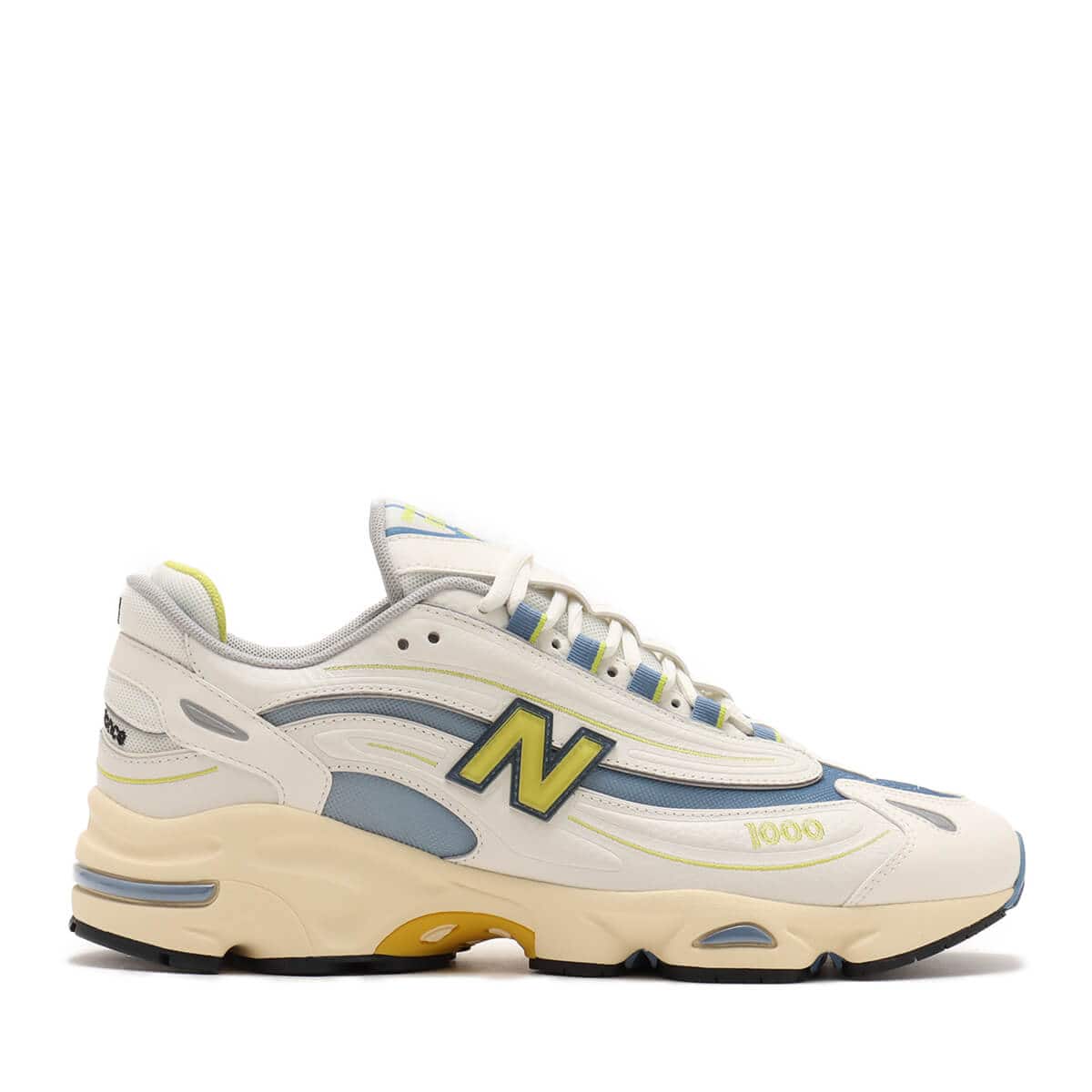 Iconic M1000 training shoe reissue in vibrant colors with cushioned Full ABZORB heel and sleek synthetic leather and mesh design.

