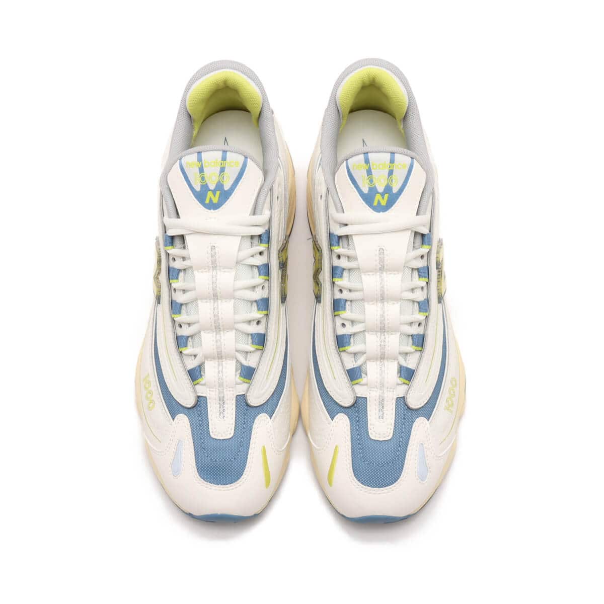 Iconic M1000 training shoe reissue in vibrant colors with cushioned Full ABZORB heel and sleek synthetic leather and mesh design.

