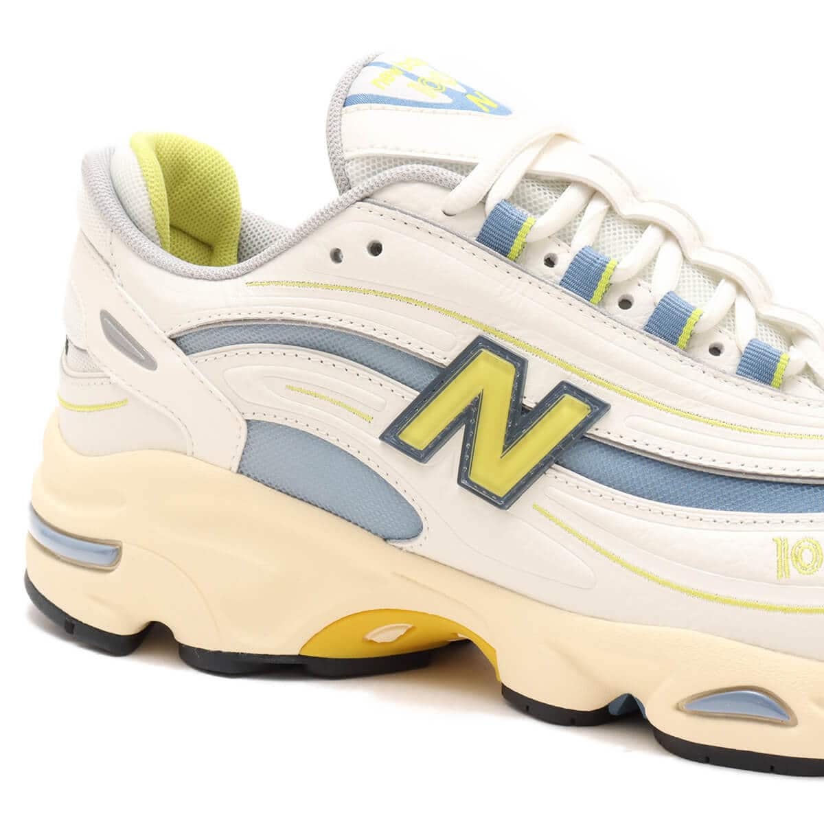 Iconic M1000 training shoe reissue in vibrant colors with cushioned Full ABZORB heel and sleek synthetic leather and mesh design.

