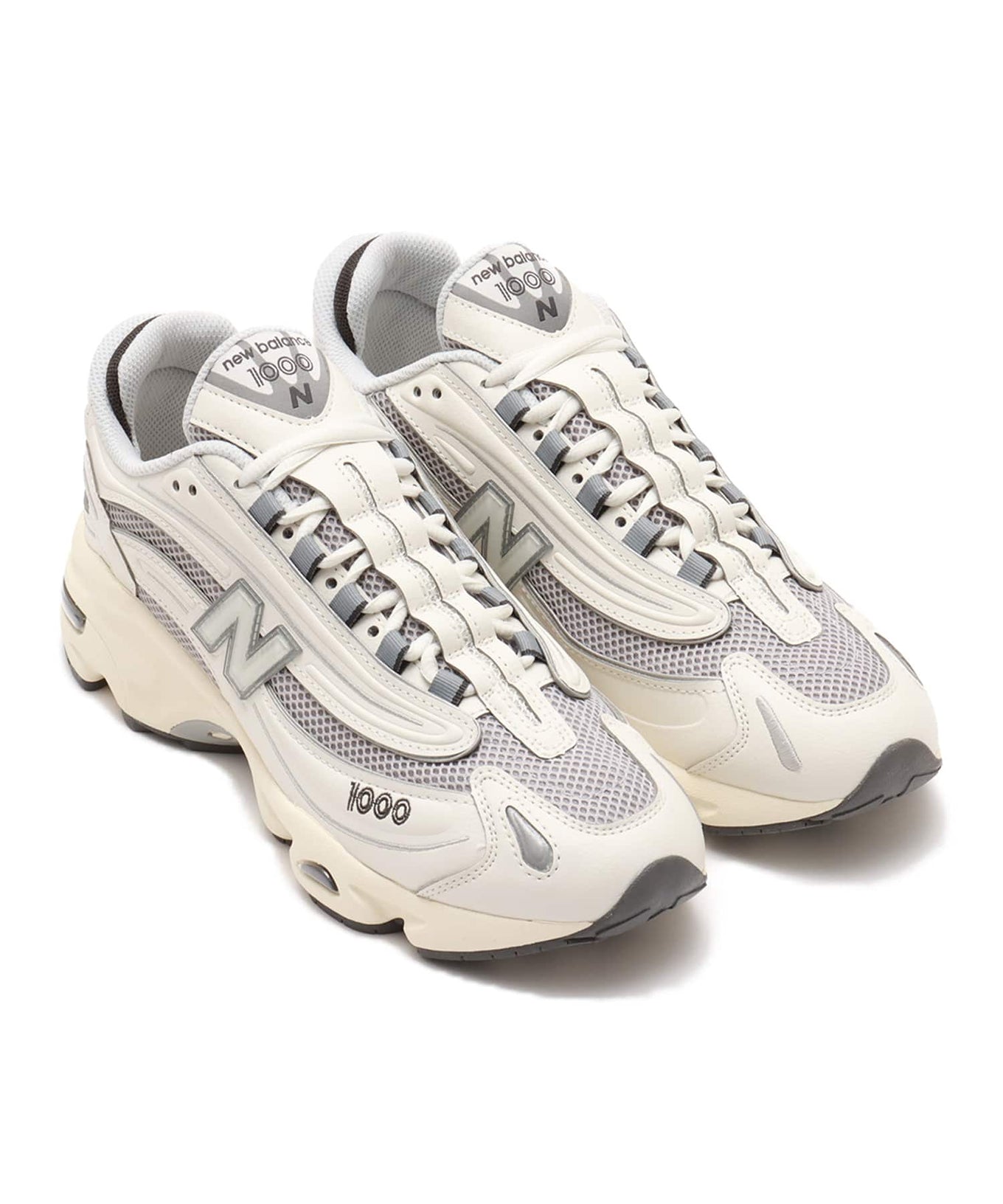 New Balance M1000 sneakers featuring mesh and leather upper with ABZORB cushioned midsole in a classic-meets-modern design