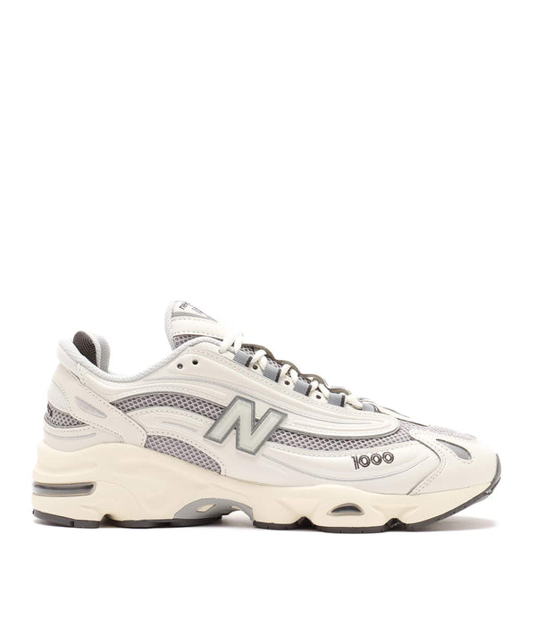 New Balance M1000 sneakers featuring mesh and leather upper with ABZORB cushioned midsole in a classic-meets-modern design