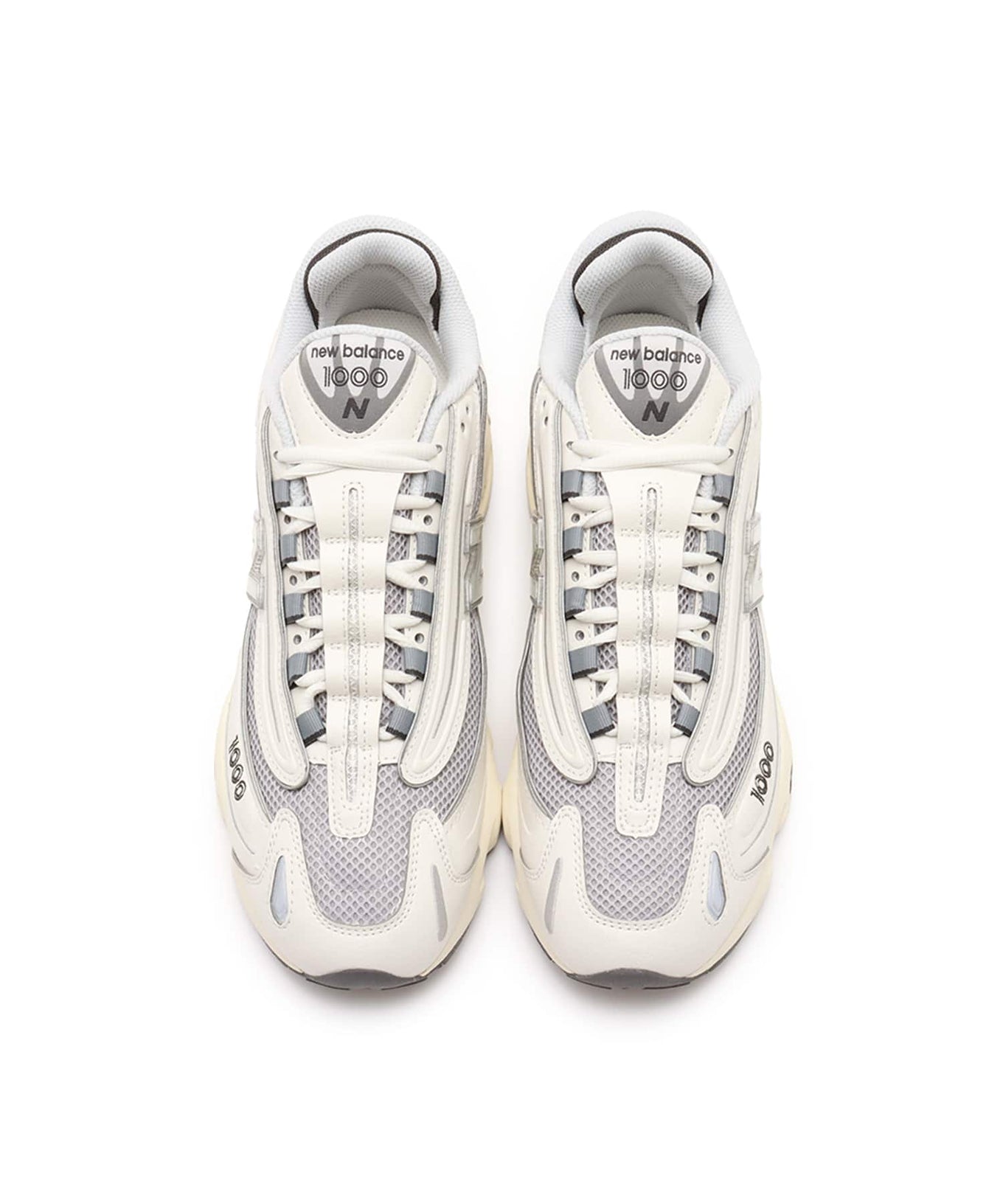 New Balance M1000 sneakers featuring mesh and leather upper with ABZORB cushioned midsole in a classic-meets-modern design