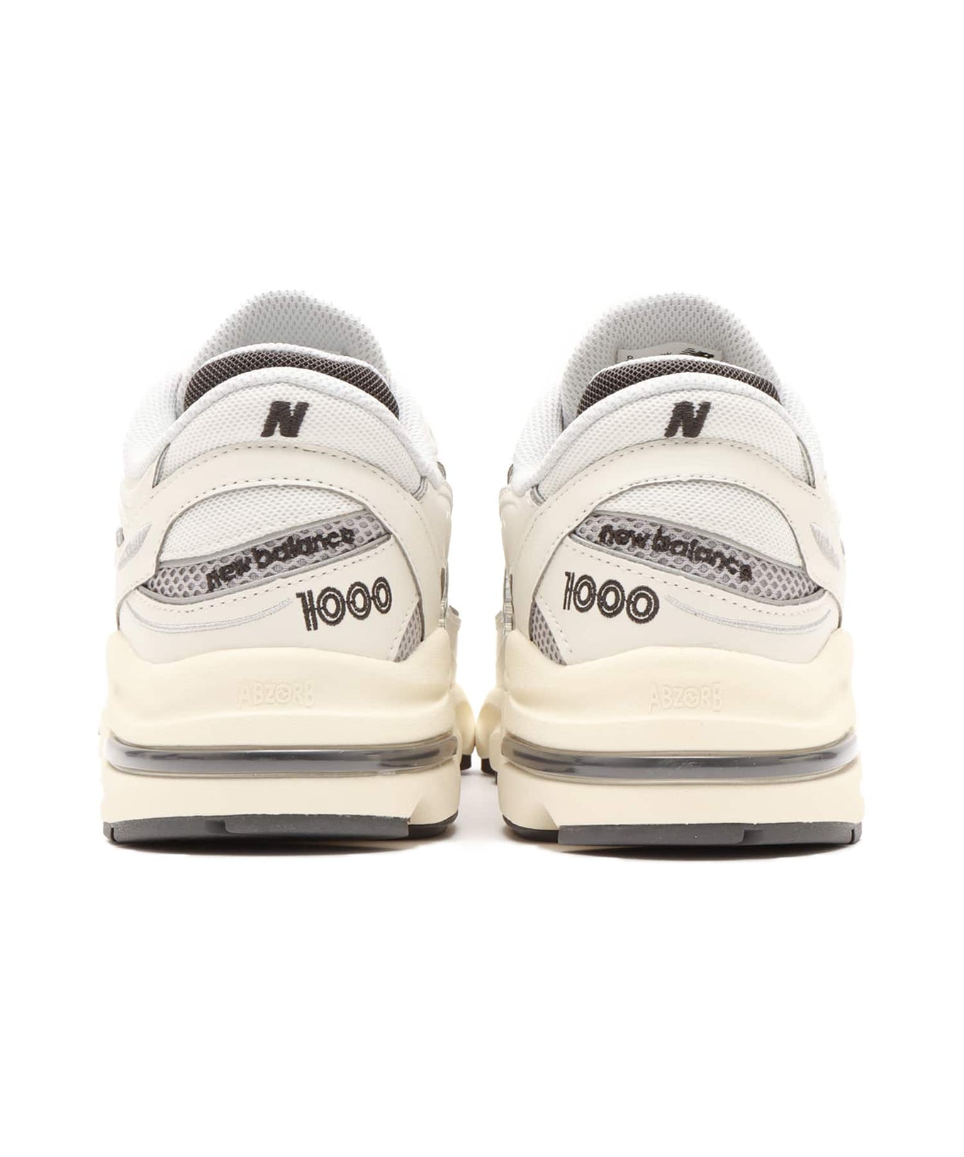 New Balance M1000 sneakers featuring mesh and leather upper with ABZORB cushioned midsole in a classic-meets-modern design
