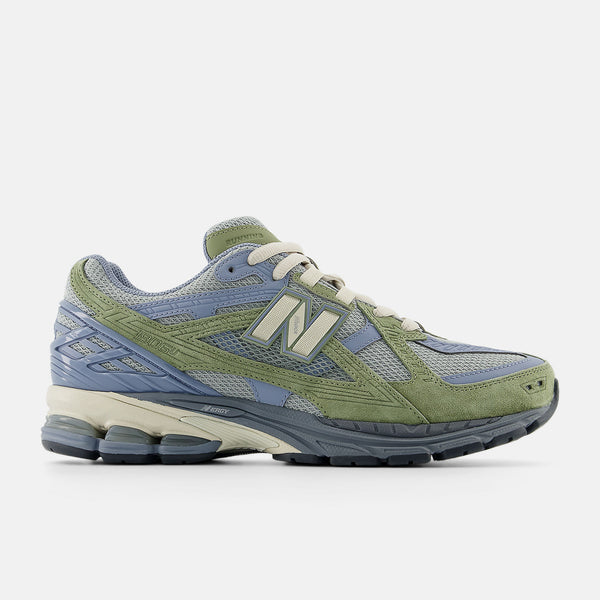 New Balance M1906U shoes with mesh and leather upper, featuring N-Durance rubber sole, N-Ergy cushioning, and Stability Web support.


