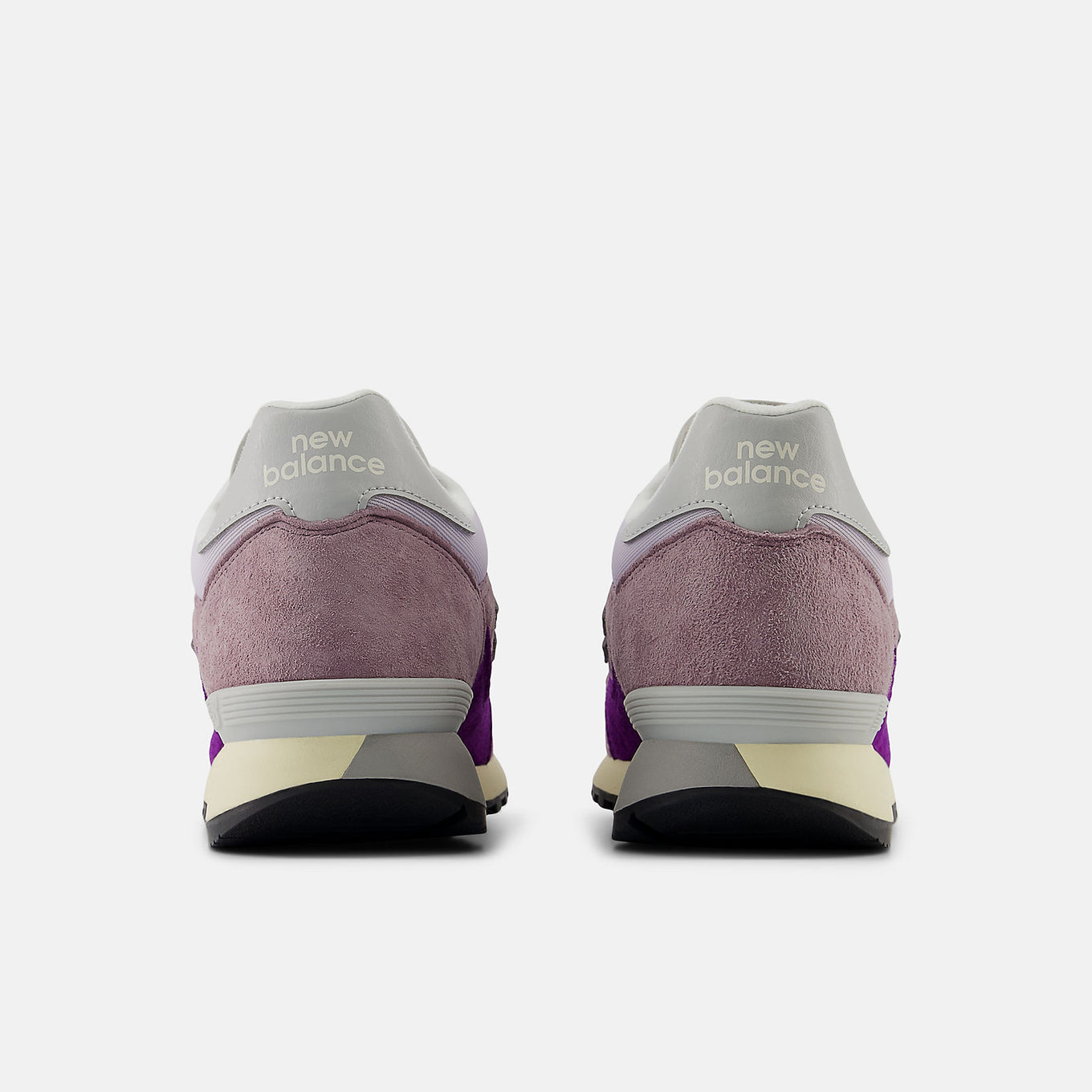 New Balance 475 sneaker from 1986 with suede and leather overlays, classic mesh base, lugged outsole, and reflective detailing.