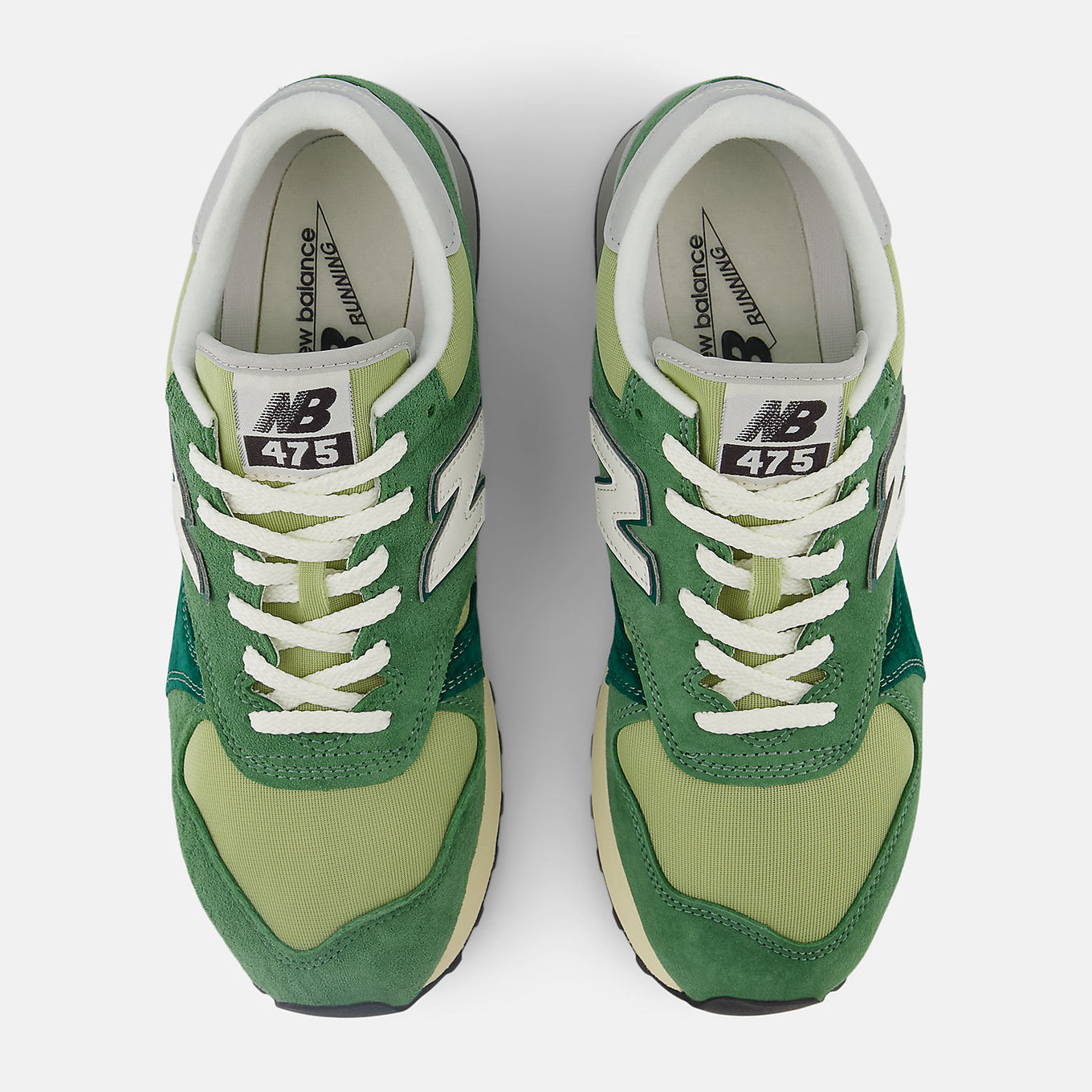 New Balance 475 sneaker from 1986 with suede and leather overlays, classic mesh base, lugged outsole, and reflective detailing.