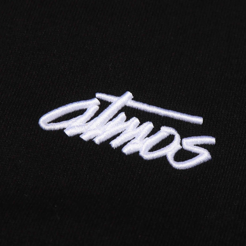 Crew neck sweatshirt with 3D embroidered atmos logo, zippered pocket, and textured open-end yarn fabric, featuring fleece lining for added volume.