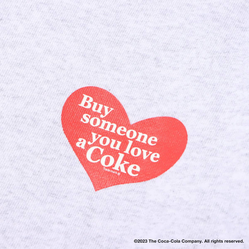 Coca-Cola x atmos crew neck sweatshirt with embroidered front motif and printed lyrics, made from heavyweight cotton fleece.