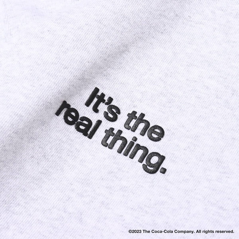 Coca-Cola x atmos crew neck sweatshirt with embroidered front motif and printed lyrics, made from heavyweight cotton fleece.