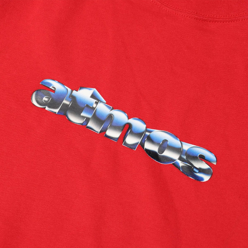 Short-sleeved T-shirt with metallic rubber-printed atmos logo, soft fabric, relaxed fit, and pin name tag on left hem.