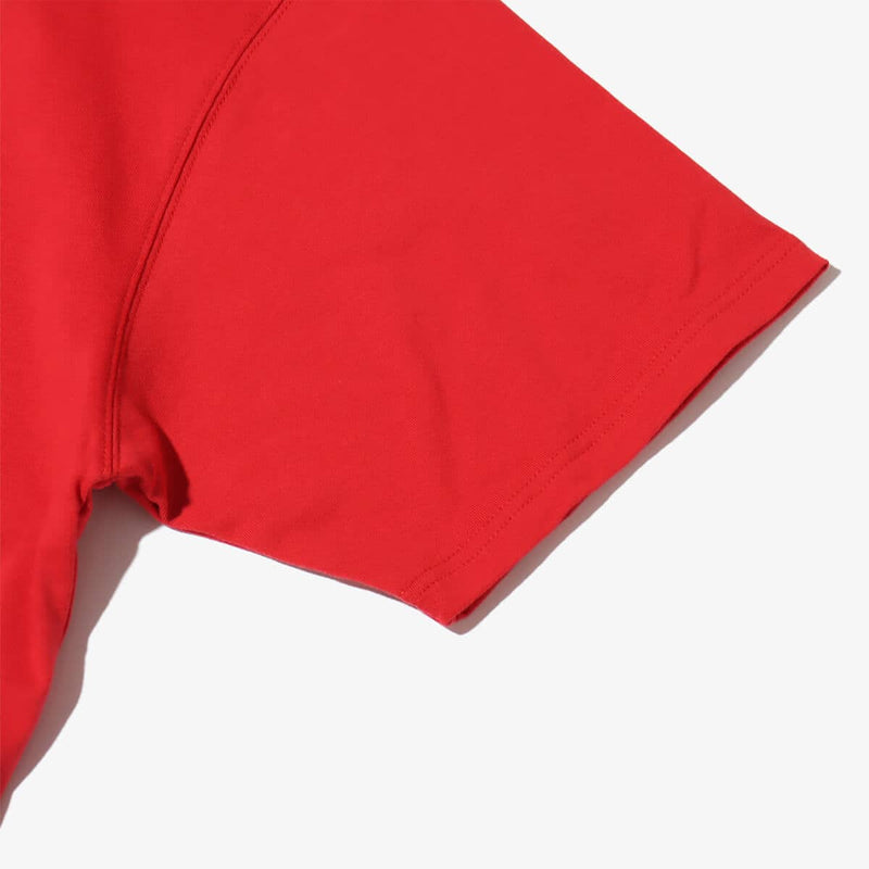 Short-sleeved T-shirt with metallic rubber-printed atmos logo, soft fabric, relaxed fit, and pin name tag on left hem.