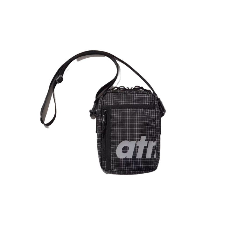 Mini shoulder bag made from durable grid nylon fabric with partition and zipper pockets, featuring a reflective atmos motif for style and nighttime visibility.