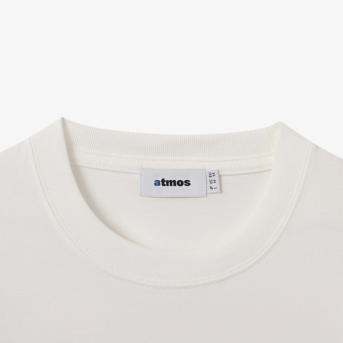 Short-sleeve T-shirt with a textured jersey fabric and a 1990s-inspired electronics graphic design, featuring inkjet and gel printing techniques. 