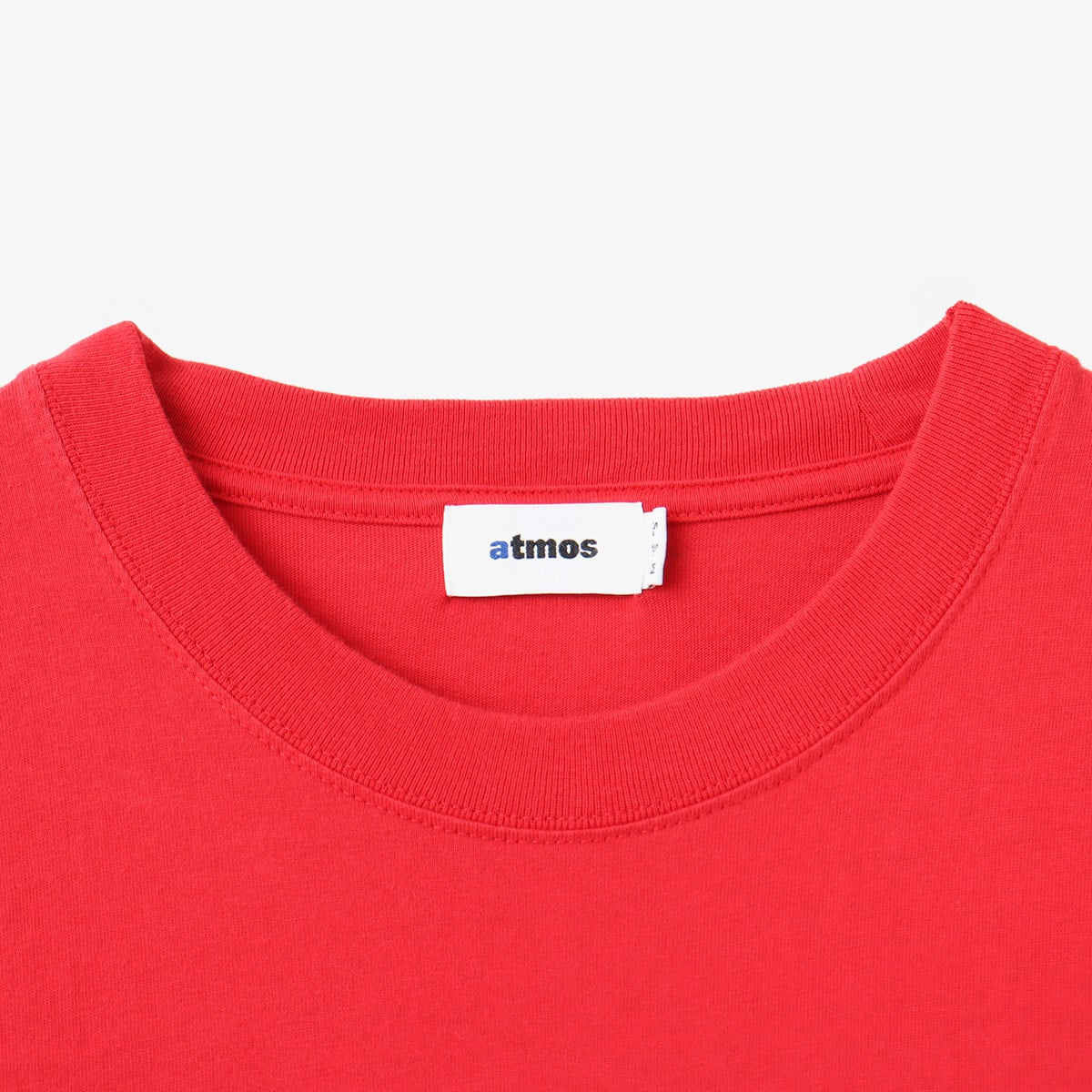 Atmos short-sleeved T-shirt with Old English-style Atmos Crew motif on the front and blue pistag on the left hem, crafted from soft, smooth fabric. Model height 180cm, wearing size L.