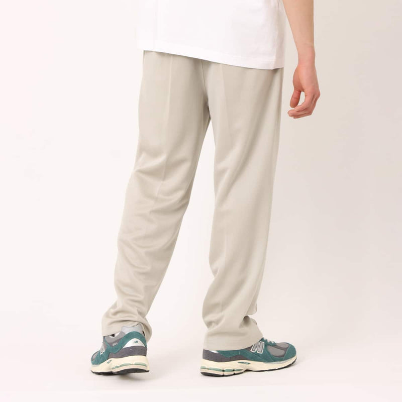 Men’s pin tuck trouser pants in Japanese Toray jersey with elastic waistband, bias pockets, and zippered back pocket