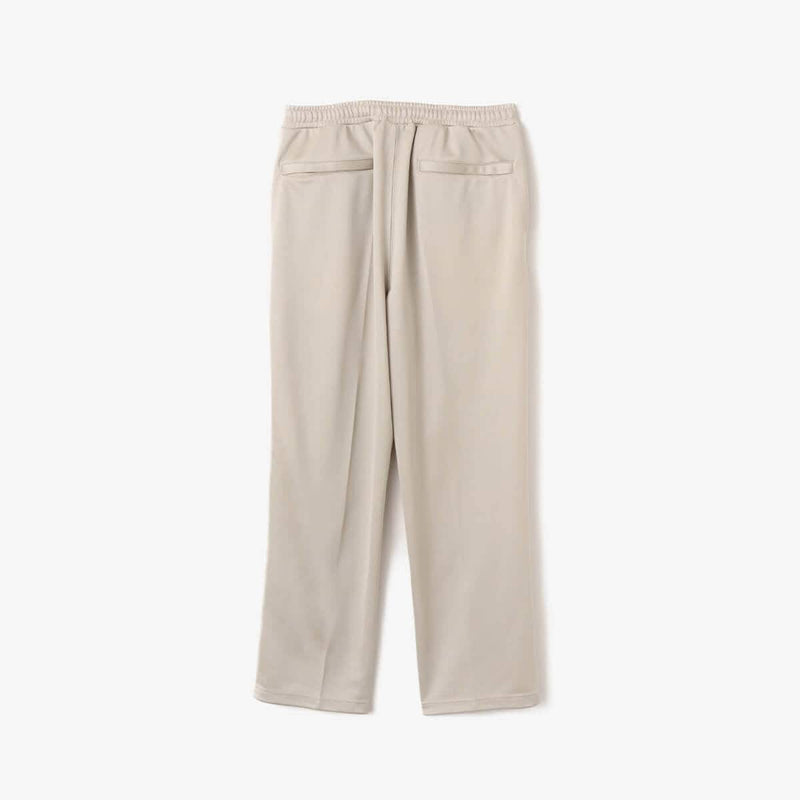 Men’s pin tuck trouser pants in Japanese Toray jersey with elastic waistband, bias pockets, and zippered back pocket