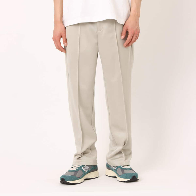 Men’s pin tuck trouser pants in Japanese Toray jersey with elastic waistband, bias pockets, and zippered back pocket