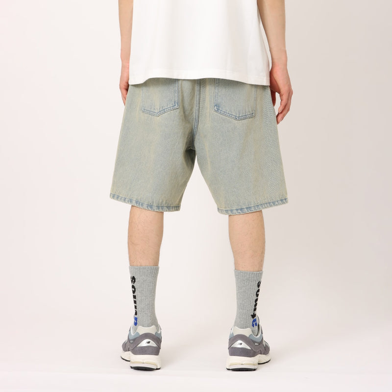 Men's baggy denim shorts with a bleached finish, printed pigment design, and adjustable waistband with spindle.