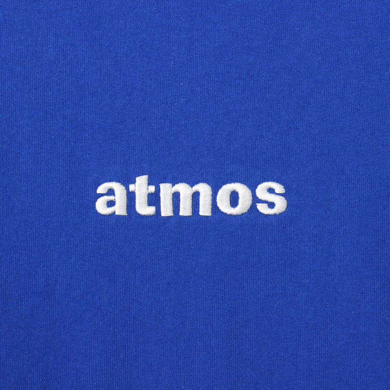 Standard T-shirt with classic "atmos" logo embroidered on the front, blue pistag on the left hem, and made from 9-ounce 26/2 American cotton fabric.


