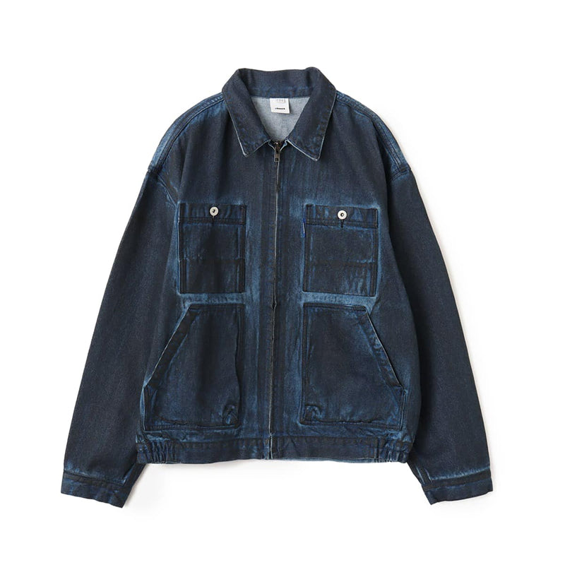 Boxy denim jacket with vintage wash, workwear details, and relaxed fit, styled with cargo pants.