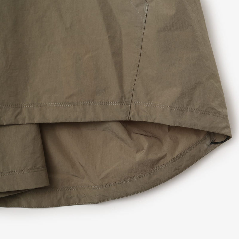 Lightweight, water-repellent anorak jacket with zippered back panel for wearing over a backpack