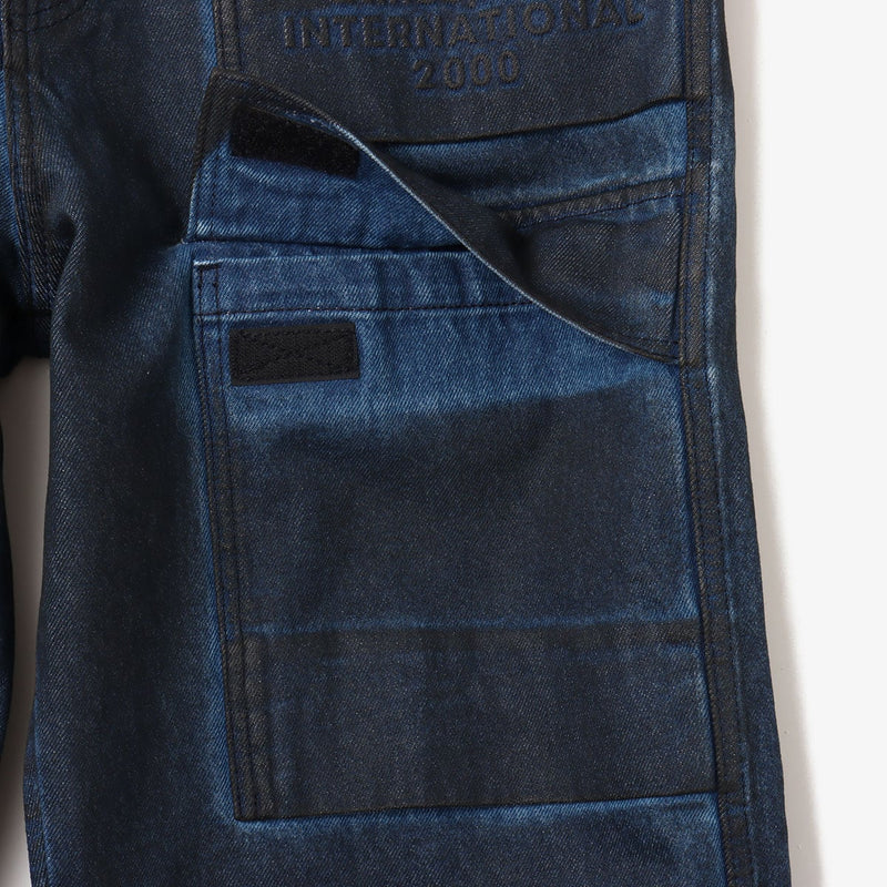 Vintage wash denim work pants with GI buckle waist, styled with matching denim jacket.