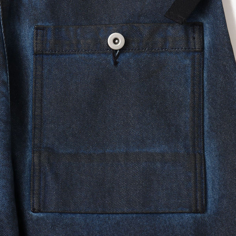 Vintage wash denim work pants with GI buckle waist, styled with matching denim jacket.