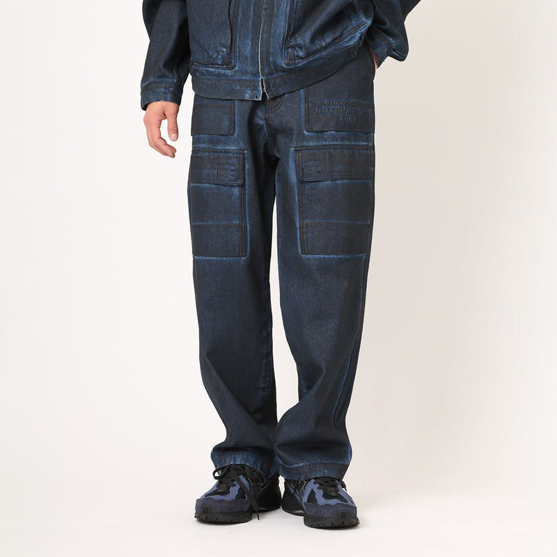 Vintage wash denim work pants with GI buckle waist, styled with matching denim jacket.