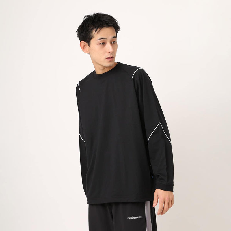 Sporty long-sleeve polyester T-shirt with raglan sleeves, reflective atmos logo on back neck, worn by 180cm model in size L