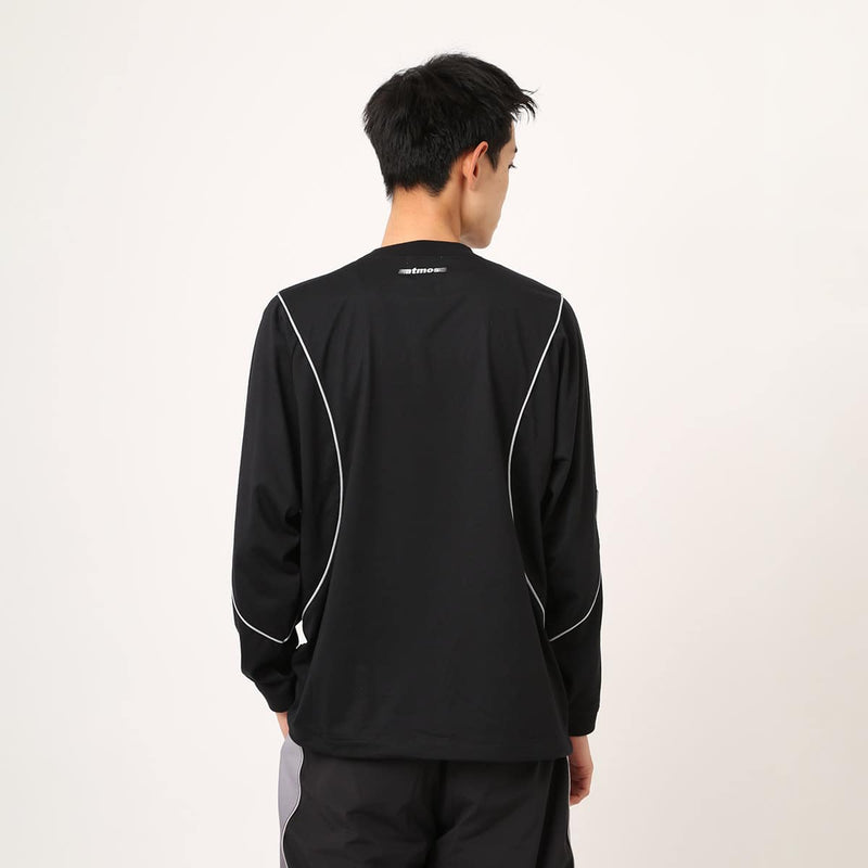 Sporty long-sleeve polyester T-shirt with raglan sleeves, reflective atmos logo on back neck, worn by 180cm model in size L