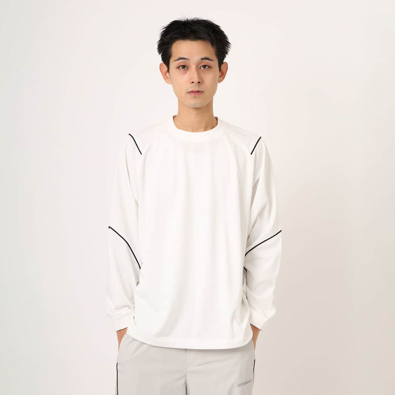 Sporty long-sleeve polyester T-shirt with raglan sleeves, reflective atmos logo on back neck, worn by 180cm model in size L