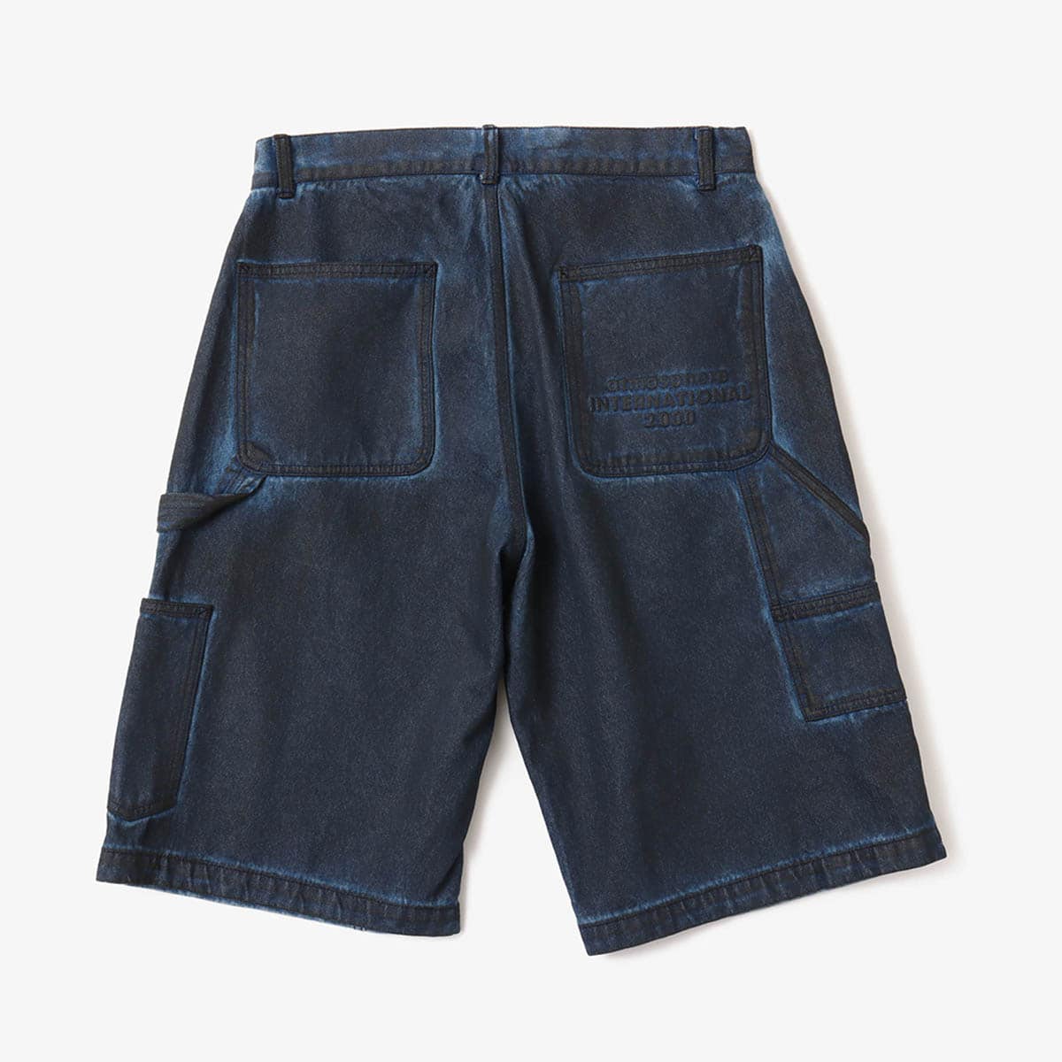 Double knee denim shorts with vintage wash and heavyweight fabric, worn by model.