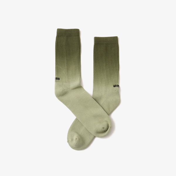 Hand-dyed gradient socks with atmos logo on heel and cushioned sole design.
