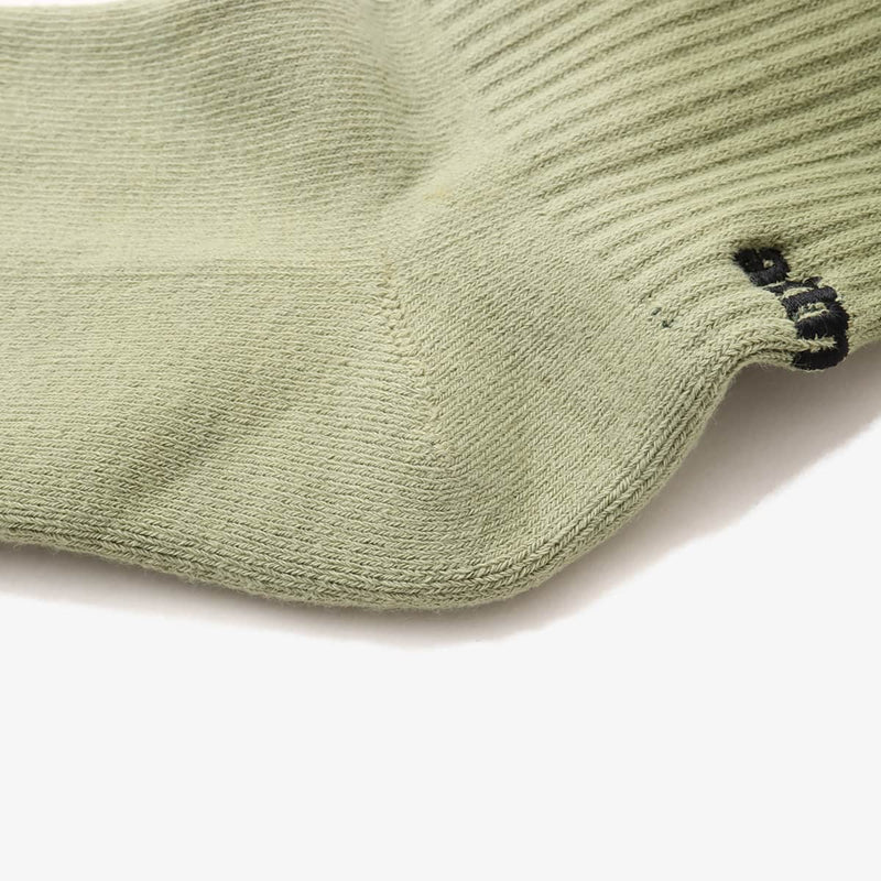 Hand-dyed gradient socks with atmos logo on heel and cushioned sole design.