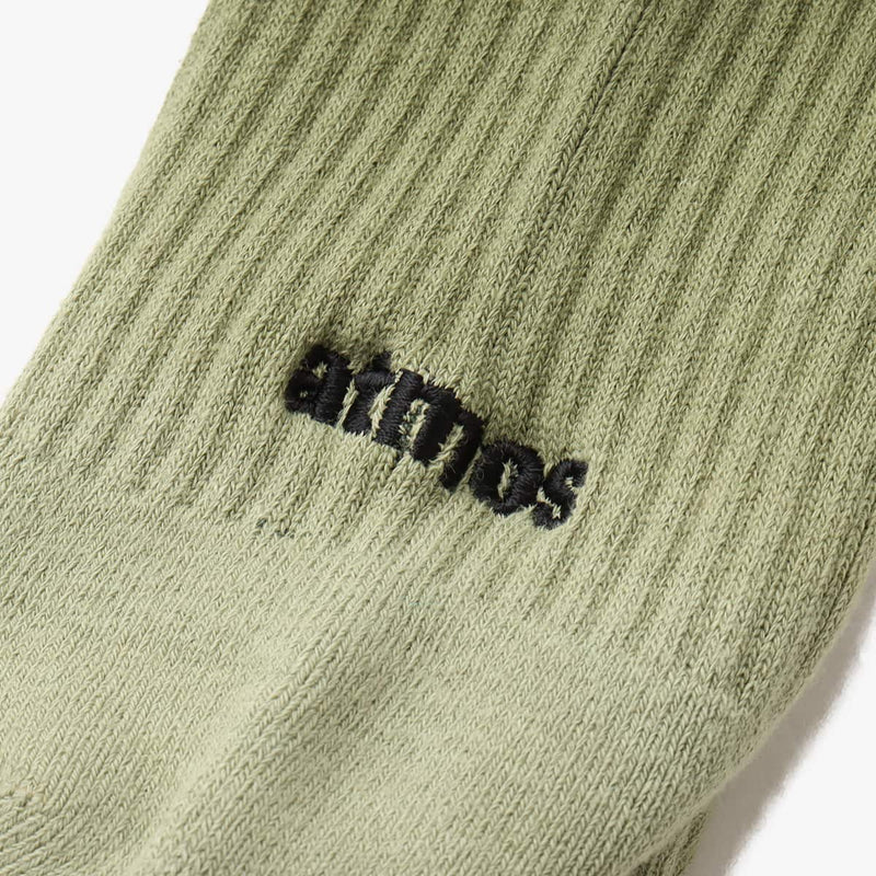 Hand-dyed gradient socks with atmos logo on heel and cushioned sole design.