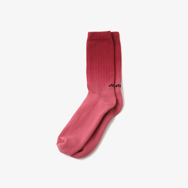 Hand-dyed gradient socks with atmos logo on heel and cushioned sole design.