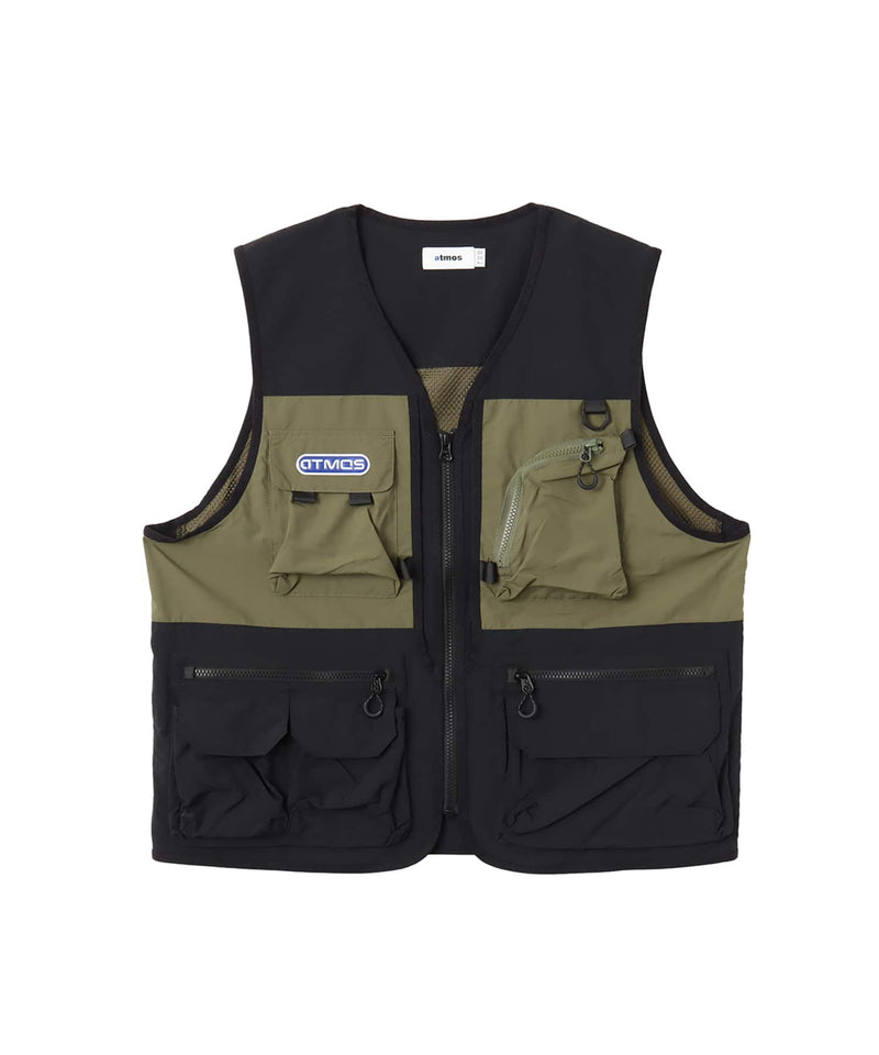 Model wearing a multi-pocket fishing-style vest made from textured nylon with a cotton-like finish.