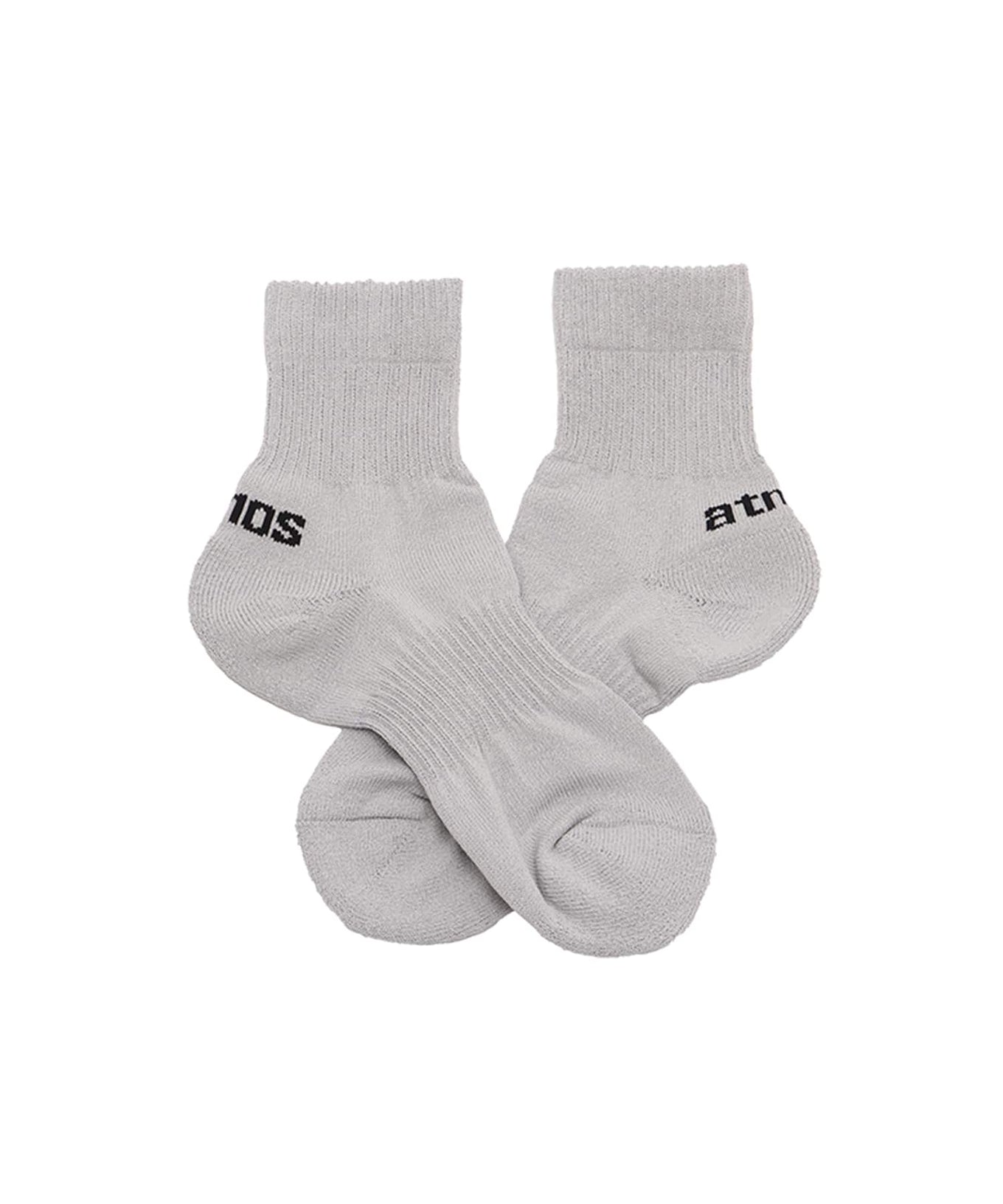Breathable ankle socks in white, black, gray, and khaki with brand logo and cushioned heel and toe