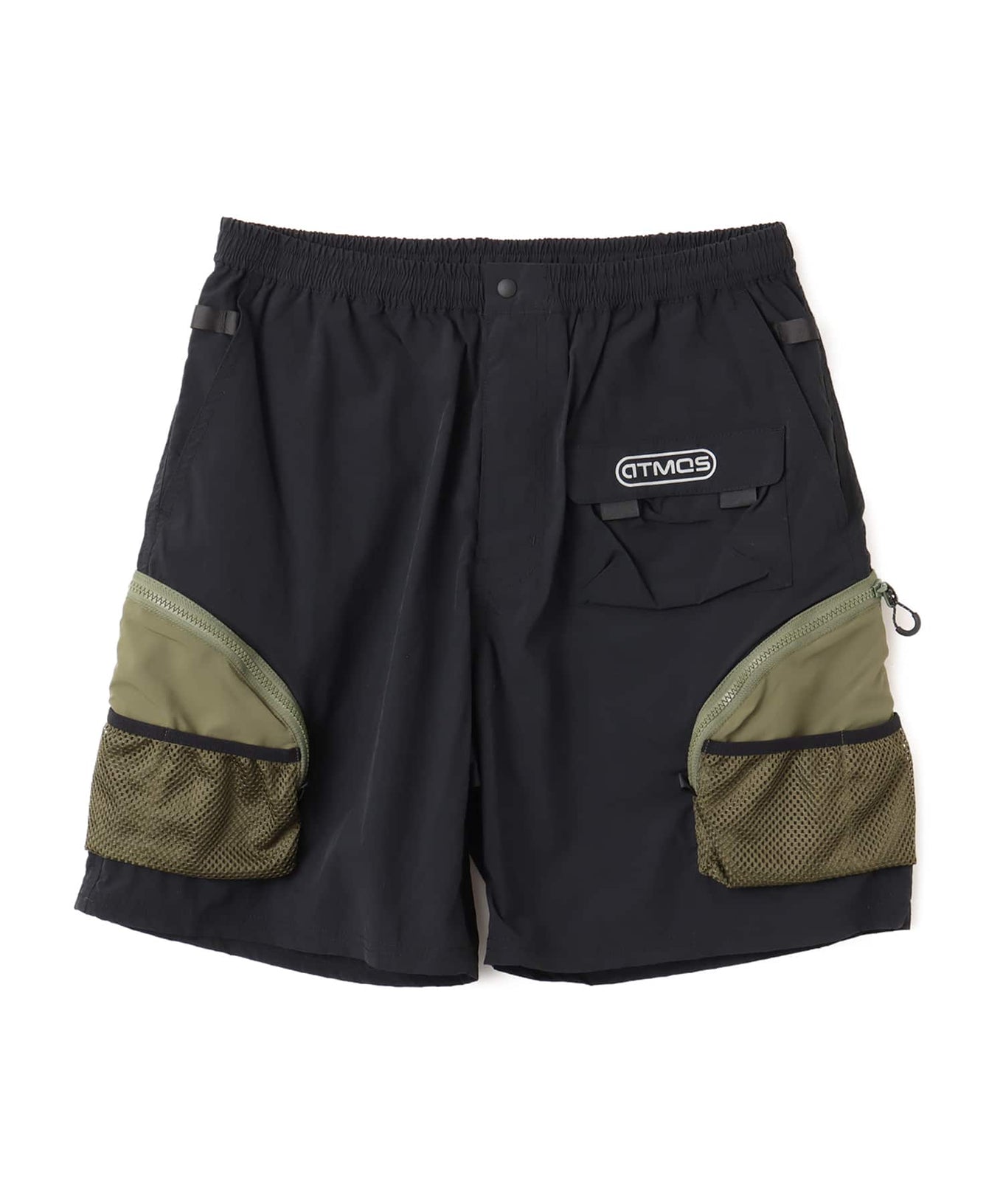 Model wearing functional cargo shorts with mesh and flap pockets in durable cotton fabric.