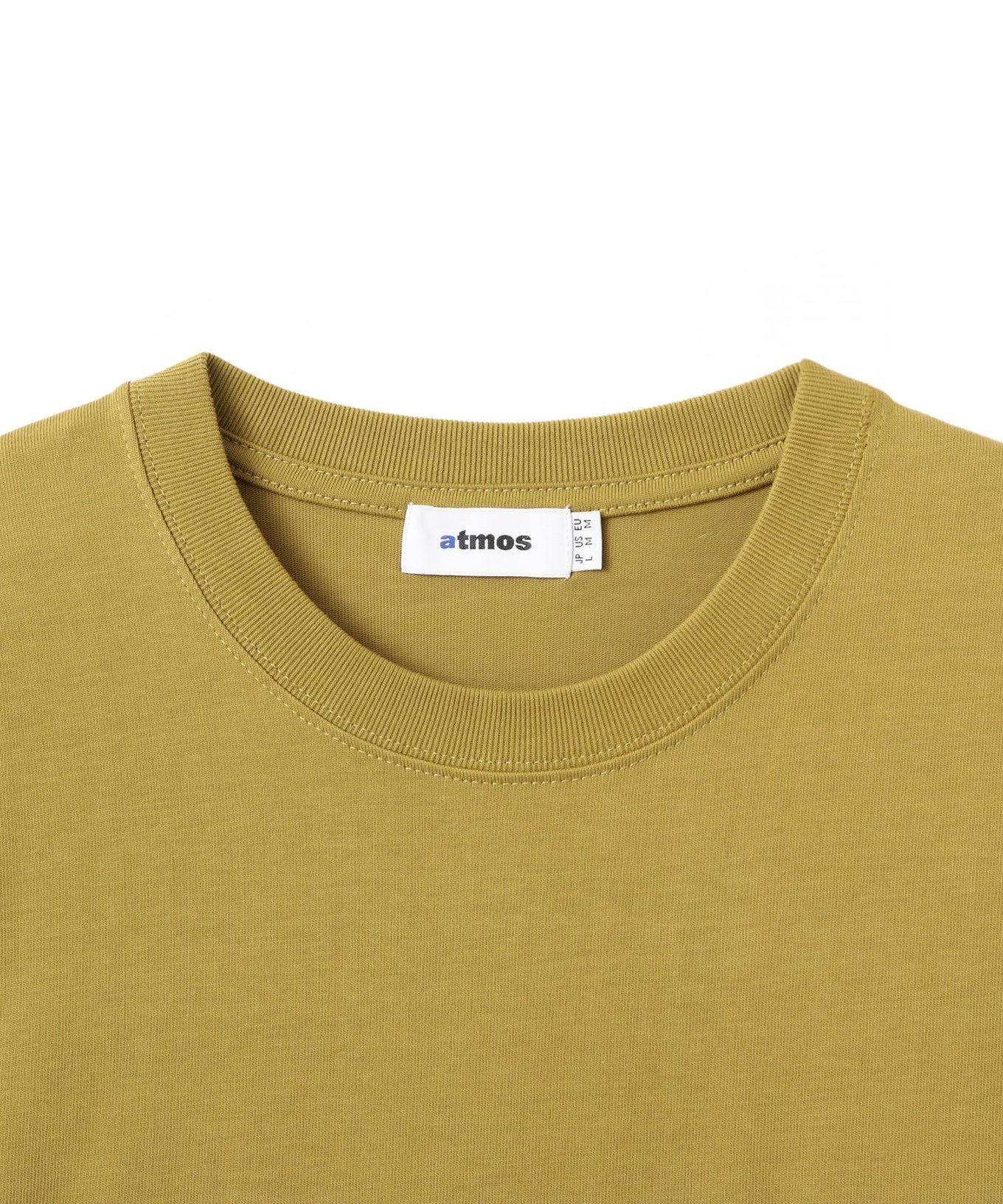 Model wearing a short-sleeved T-shirt with front zip pocket, made from textured, durable cotton.