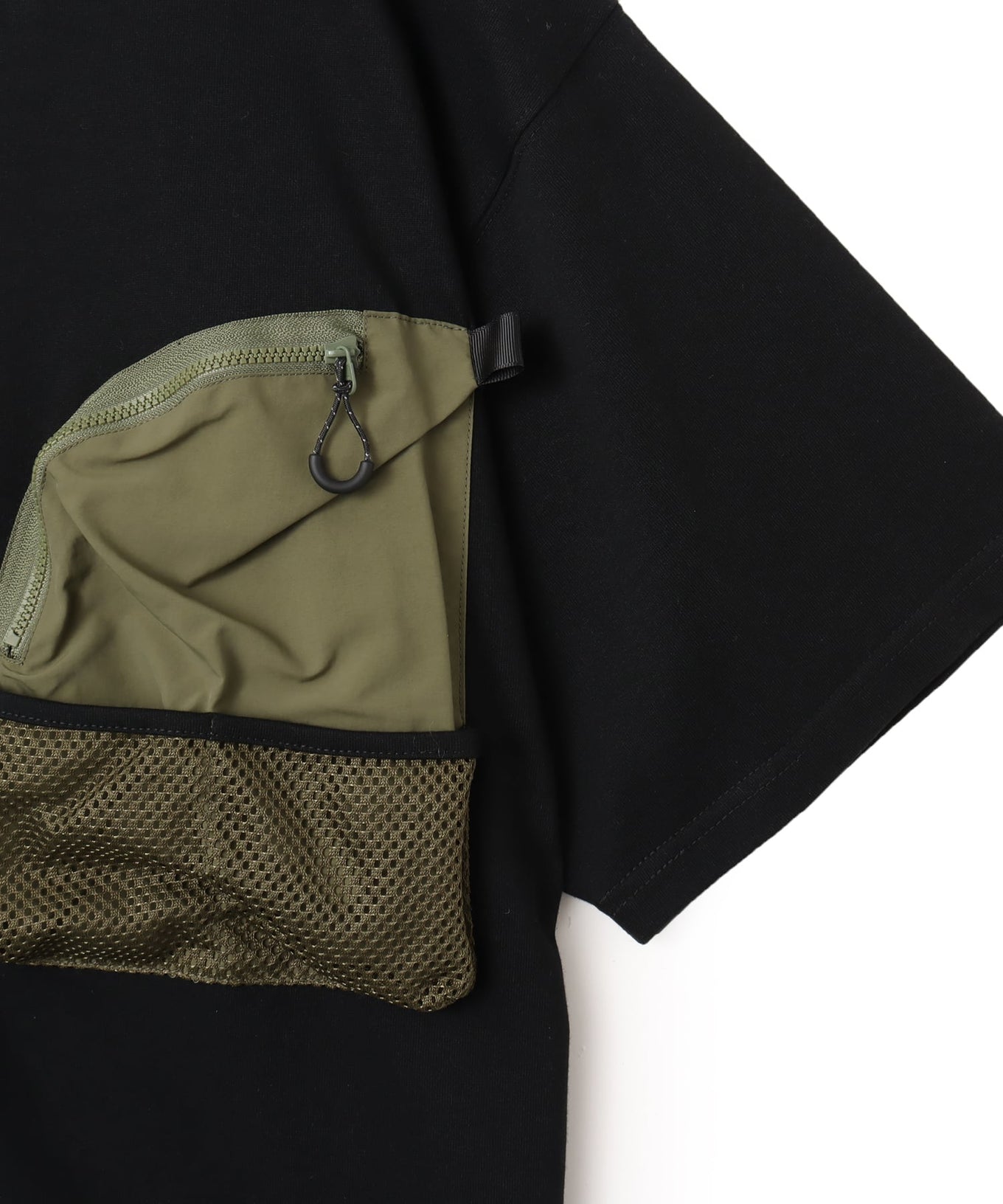 Model wearing a short-sleeved T-shirt with front zip pocket, made from textured, durable cotton.